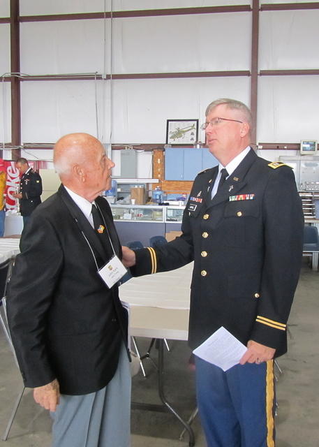 John Kark receiving instruction from Chaplain (CPT) Paul Cartmill